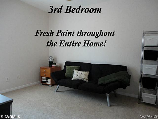 7349 Drexelbrook Road Chesterfield, VA 23832 - Photo 22 of 24 a living room with furniture and a flat screen tv