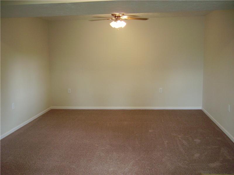 1047 Temple Road Aliquippa, PA 15001 - Photo 13 of 22 Den. Freshly painted den with new carpeting.