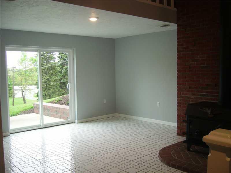 1047 Temple Road Aliquippa, PA 15001 - Photo 6 of 22 Dining Room. Dining room has sliding doors to patio, wood burning stove and gleaming ceramic tile.