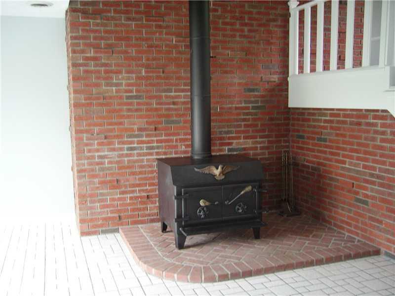 1047 Temple Road Aliquippa, PA 15001 - Photo 9 of 22 Dining Room. Wood stove in dining room