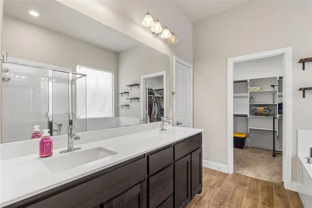 a bathroom with a sink double vanity and a mirror