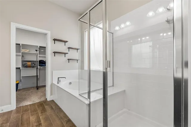 a bathroom with a bathtub and a shower