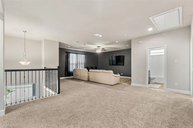 a view of a livingroom with furniture and a window