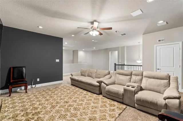 a living room with furniture and a rug