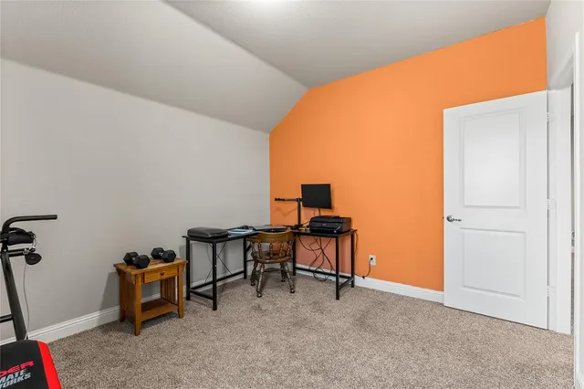 a room with furniture and a air conditioner vent
