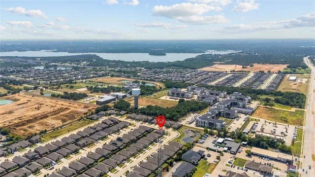an aerial view of residential building and ocean