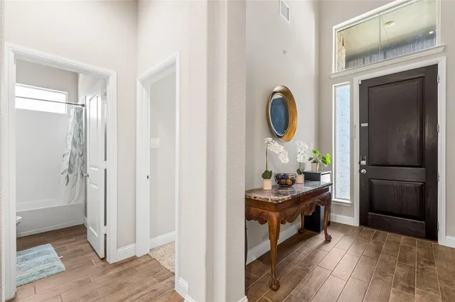 a kitchen with granite countertop a refrigerator and a stove