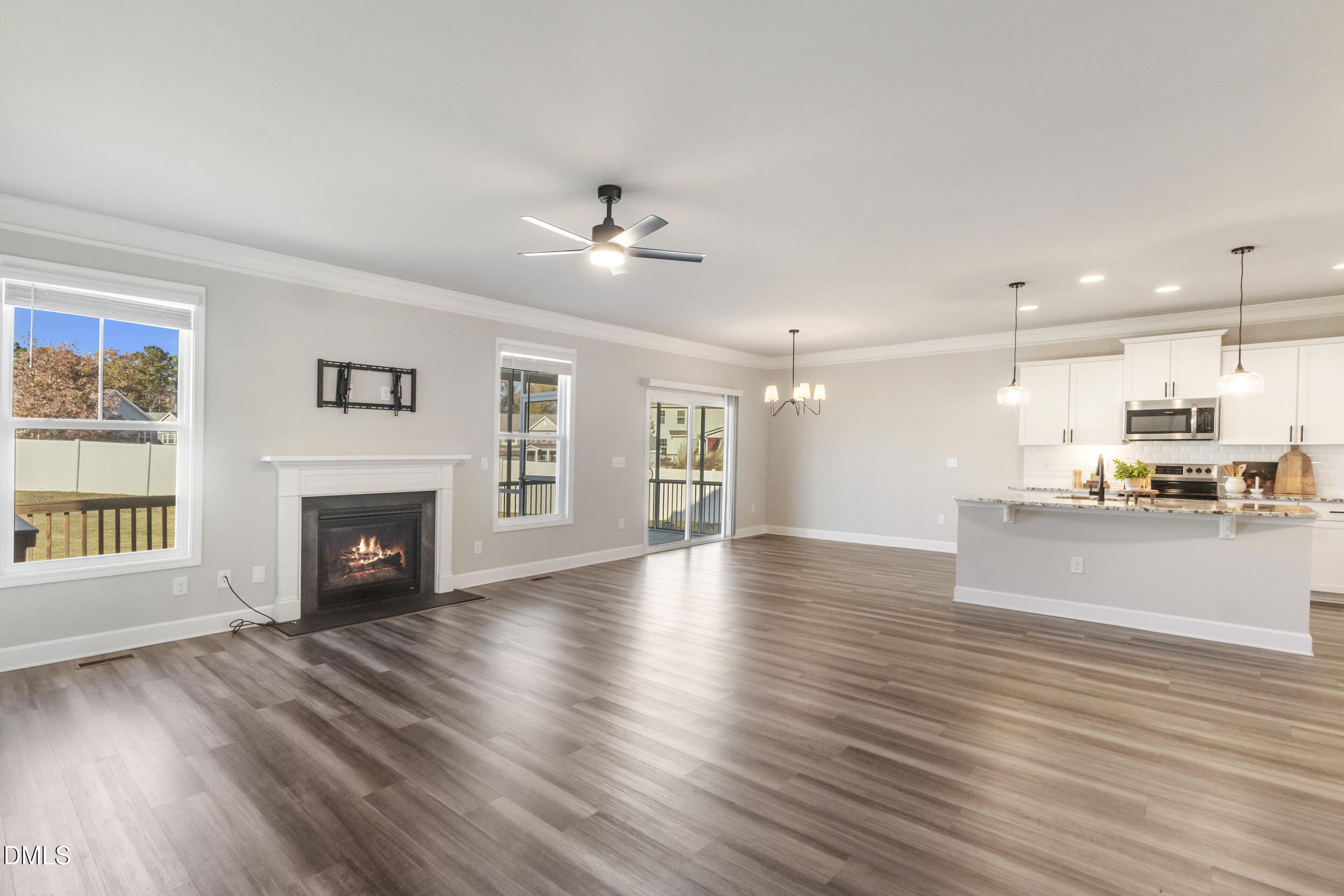 1024 JARRETT BAY Road Willow Spring, NC 27592 - Photo 43 of 43 a view of an empty room with wooden floor and a kitchen