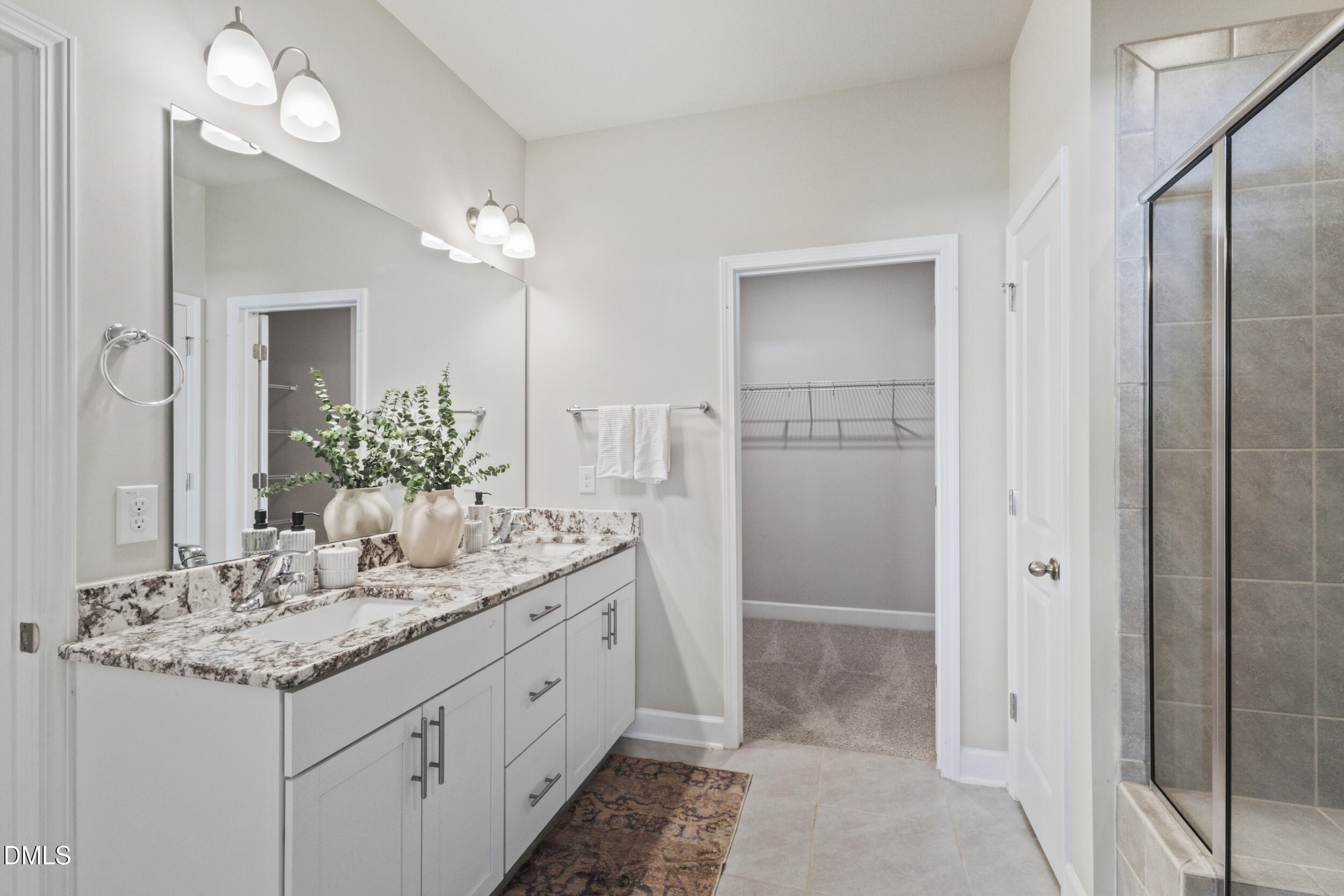 1024 JARRETT BAY Road Willow Spring, NC 27592 - Photo 19 of 43 a bathroom with a double vanity sink and a mirror