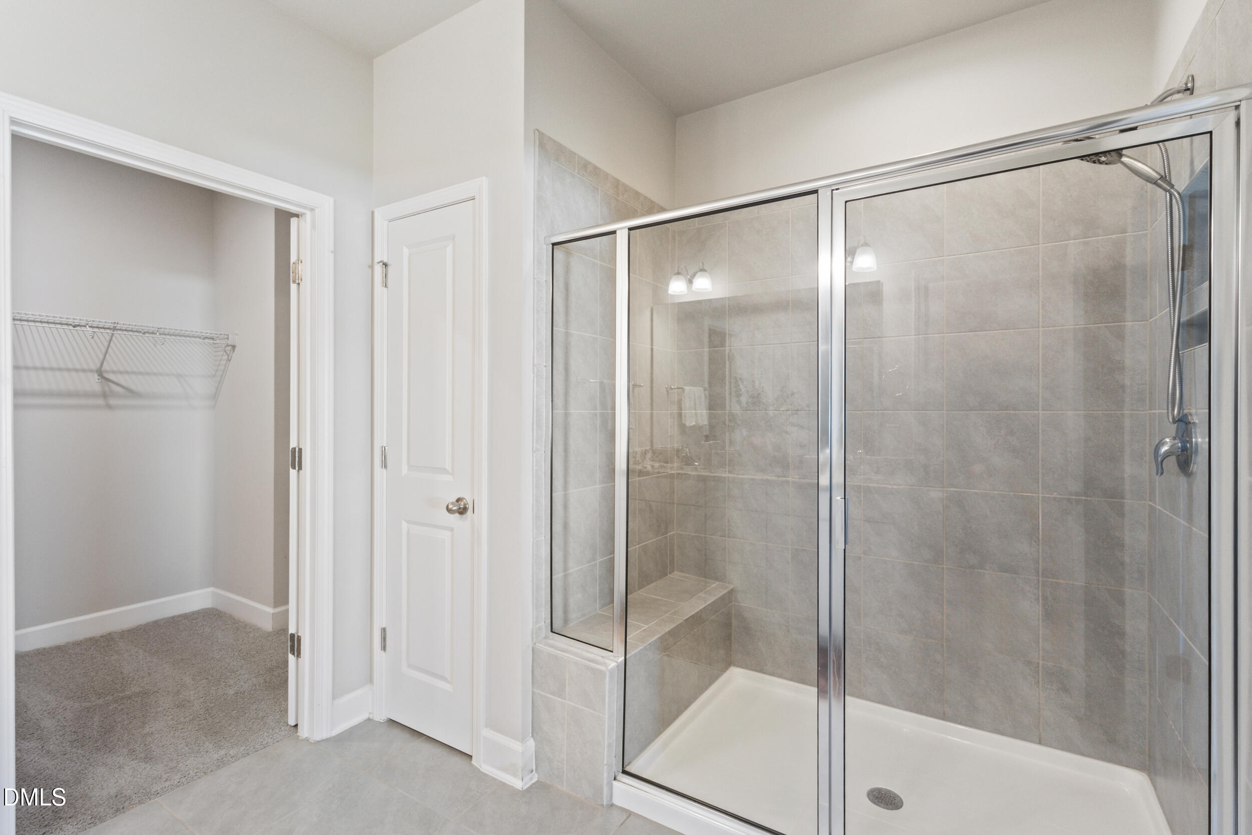 1024 JARRETT BAY Road Willow Spring, NC 27592 - Photo 20 of 43 a bathroom with a glass shower door