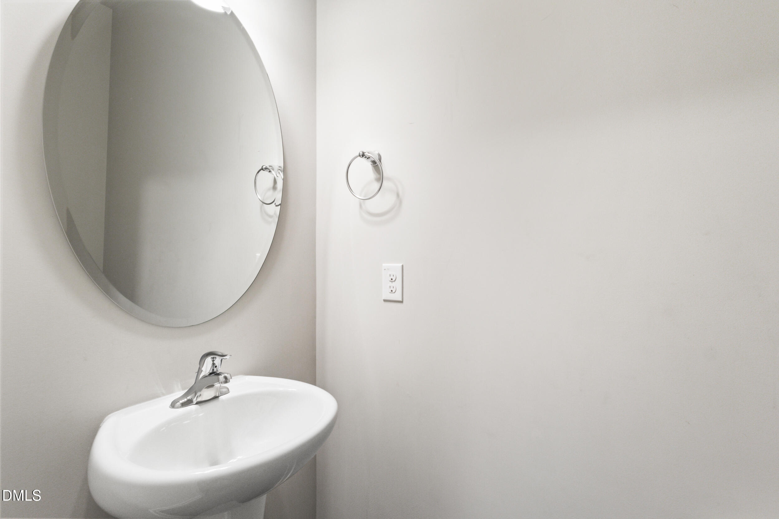 1024 JARRETT BAY Road Willow Spring, NC 27592 - Photo 24 of 43 a bathroom with a sink and mirror