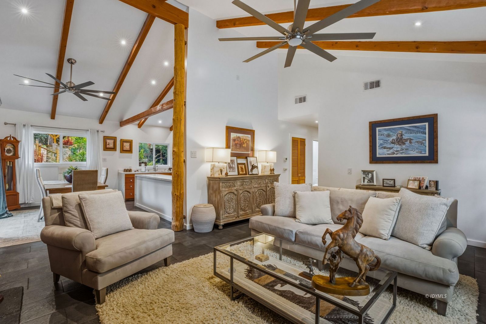 25106 Rim Rock Road Idyllwild, CA 92549 - Photo 11 of 71 a living room with furniture a ceiling fan and a rug