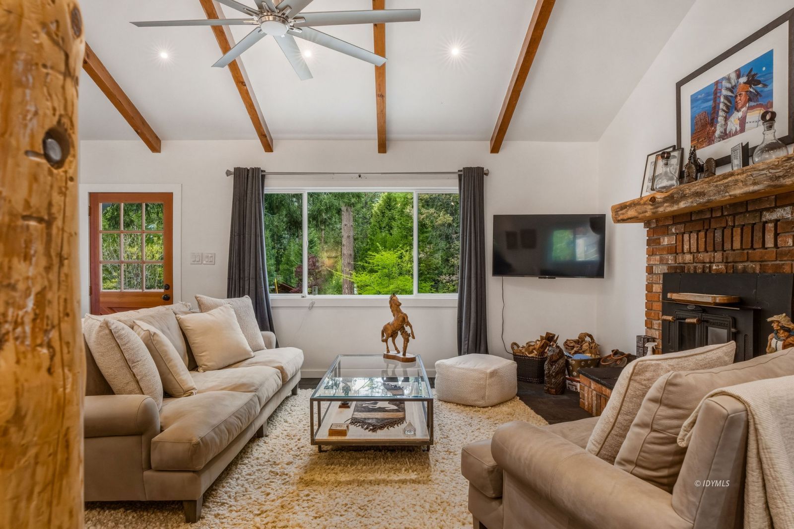 25106 Rim Rock Road Idyllwild, CA 92549 - Photo 12 of 71 a living room with furniture or outdoor view and a large window