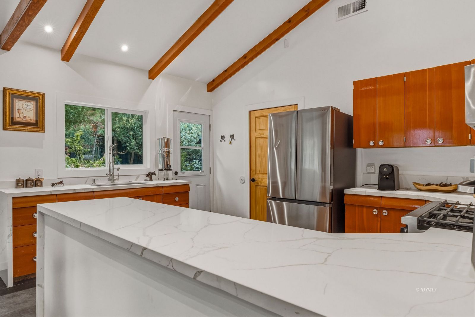 25106 Rim Rock Road Idyllwild, CA 92549 - Photo 18 of 71 a kitchen with stainless steel appliances a refrigerator stove and sink