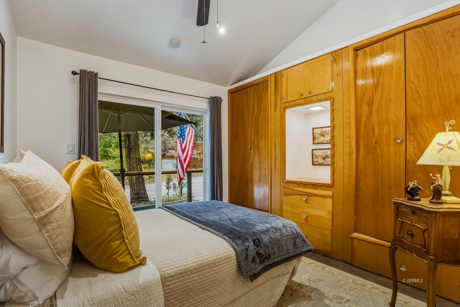 25106 Rim Rock Road Idyllwild, CA 92549 - Photo 23 of 71 a bed sitting in a bedroom next to a window