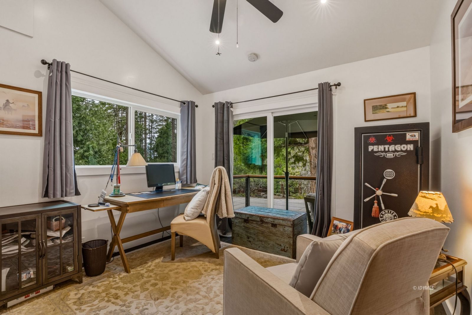 25106 Rim Rock Road Idyllwild, CA 92549 - Photo 25 of 71 a living room with furniture and a large window