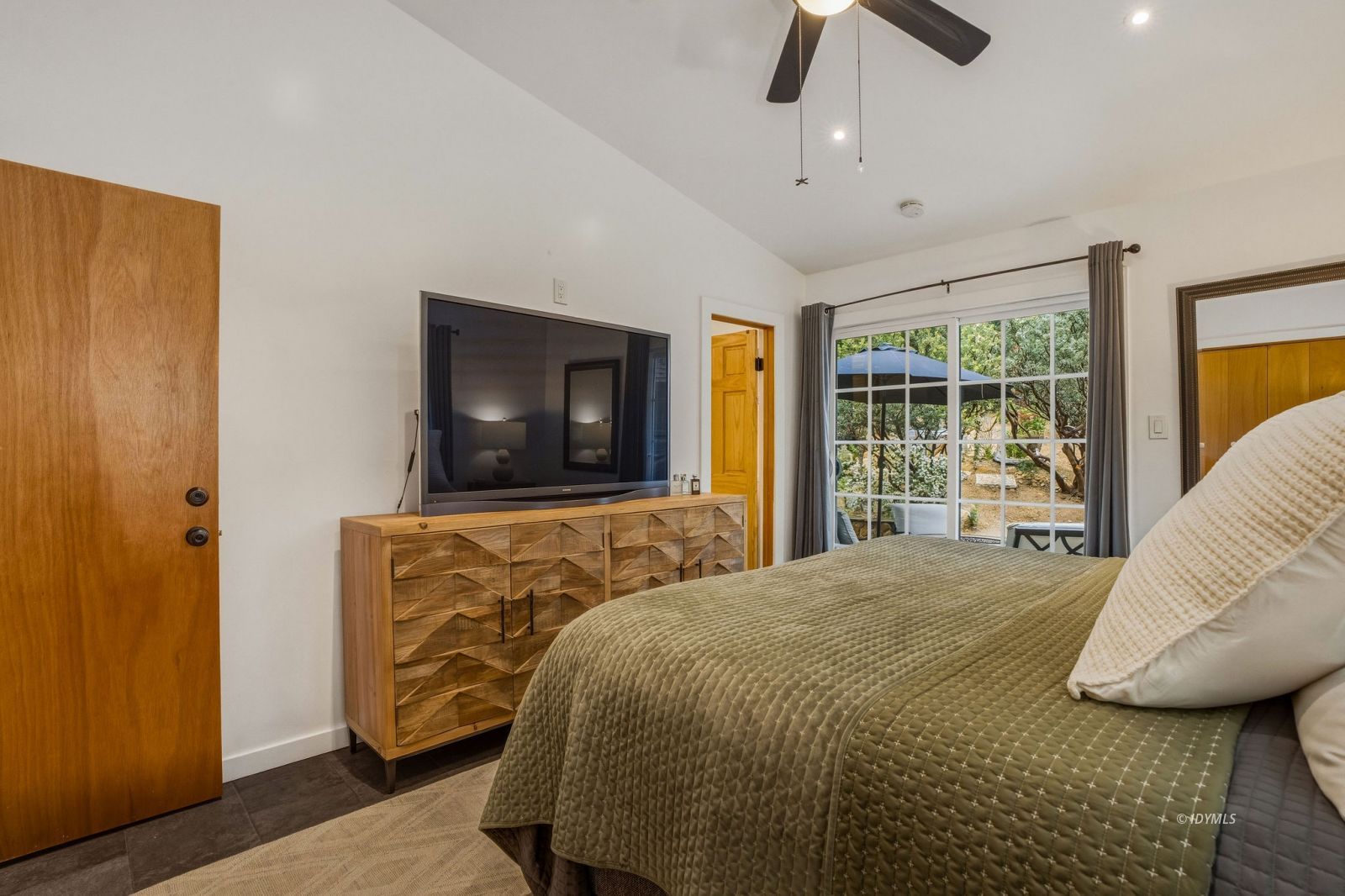 25106 Rim Rock Road Idyllwild, CA 92549 - Photo 28 of 71 a bedroom with a bed and wooden floor