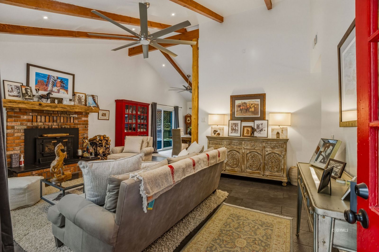 25106 Rim Rock Road Idyllwild, CA 92549 - Photo 8 of 71 a living room with furniture a fireplace and gym equipment