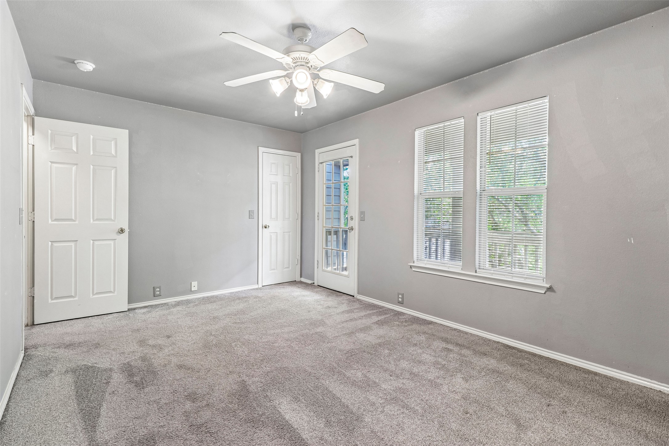 311 A Utterback Kyle, TX 78640 - Photo 24 of 40 an empty room with chandelier fan and windows
