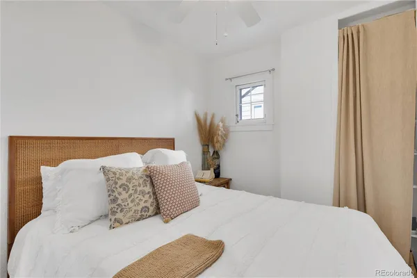 a bedroom with a bed and window