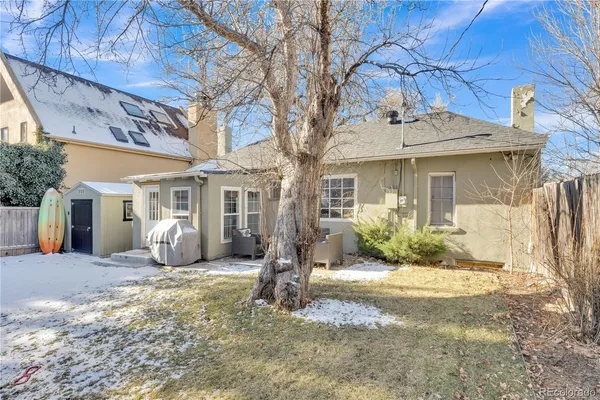 a front view of a house with yard outdoor seating and shower