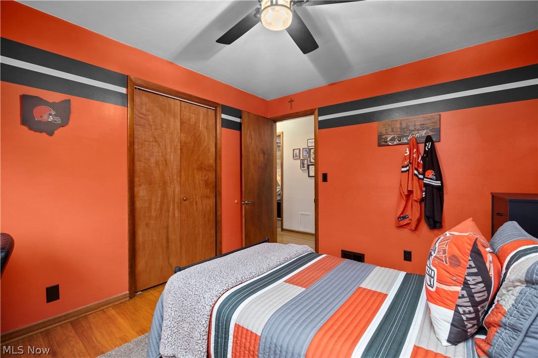 965 Gulf Road Elyria, OH 44035 - Photo 20 of 37 Bedroom featuring hardwood floors, ceiling fan, and a closet