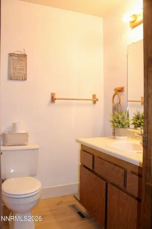 a bathroom with a toilet and a sink