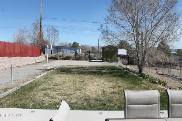 a view of a yard with furniture
