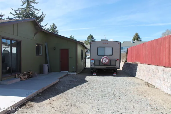 a bedroom with furniture and window