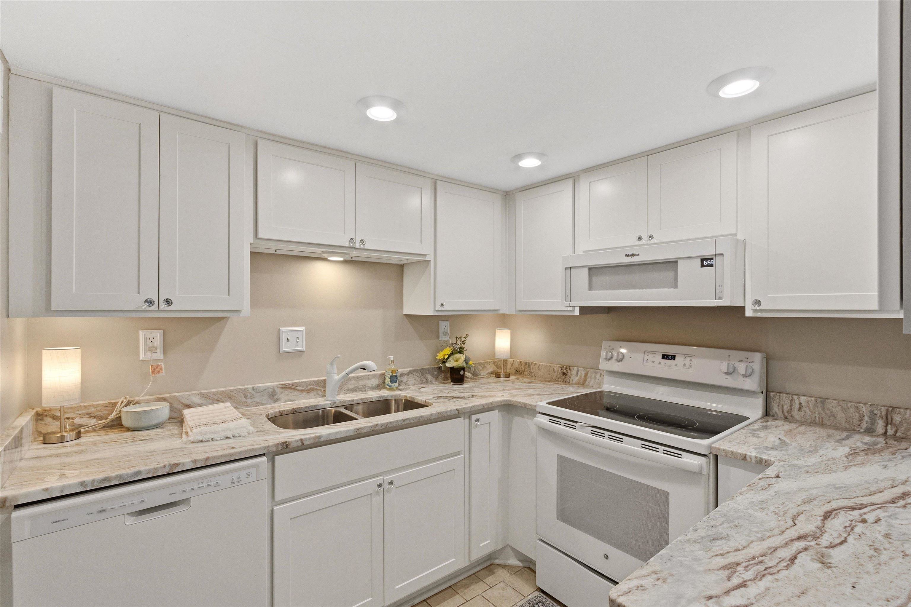 1906 Allenby Road, Unit 16 Germantown, TN 38139 - Photo 13 of 31 White cabinetry, stone countertops, dual basin sink, white range, and white dishwasher