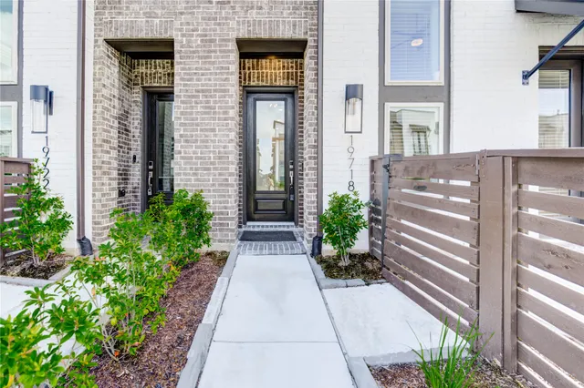 a view of a pathway both side of the house