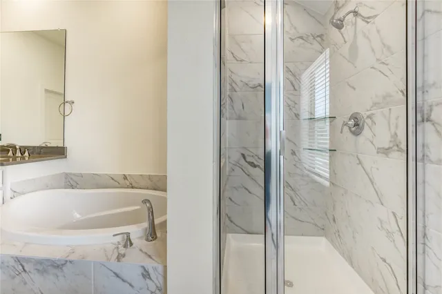a bathroom with a sink and shower