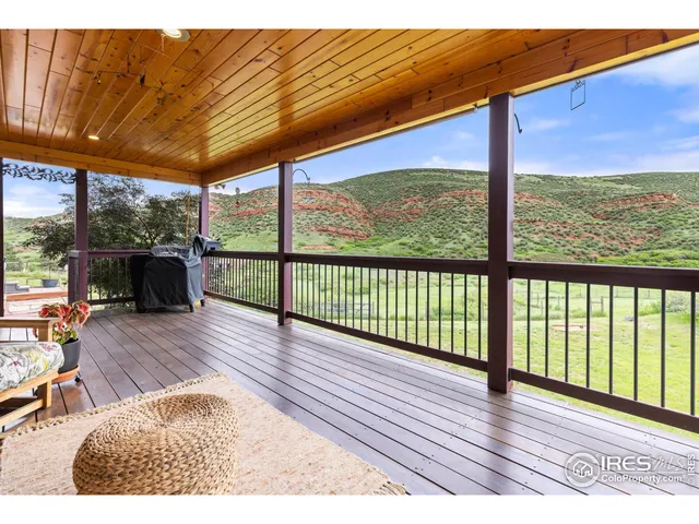 swimming pool view with a seating space and a garden