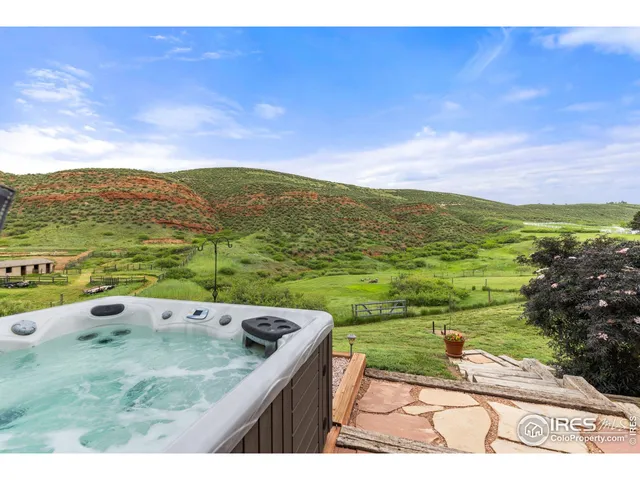 an aerial view of a house with yard swimming pool and outdoor seating