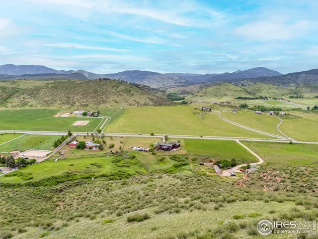 a view of a lake from a floor to ceiling window and outdoor view