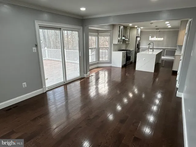 a view of a livingroom with furniture and wooden floor