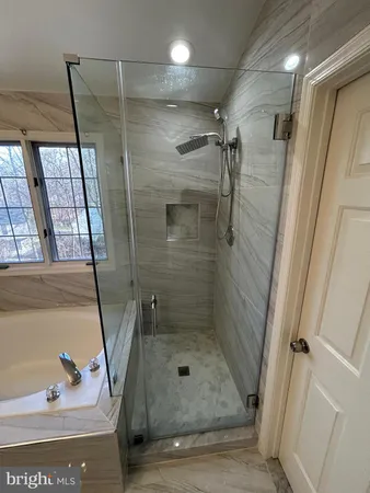 a bathroom with a double vanity sink and mirror
