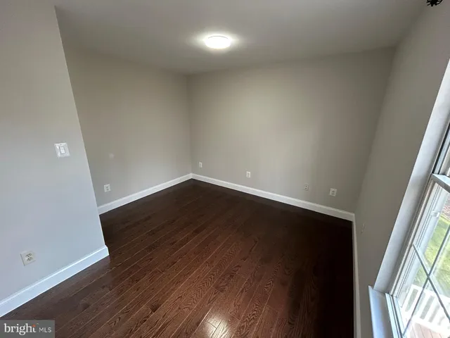 an empty room with wooden floor