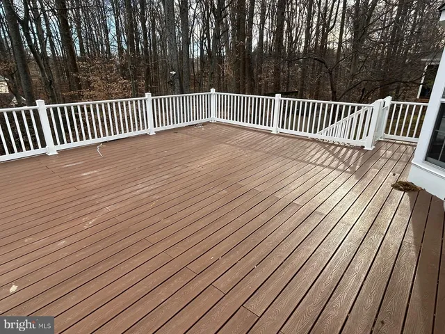 a view of a house with wooden fence