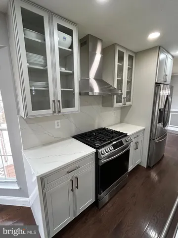a kitchen with a stove and a refrigerator