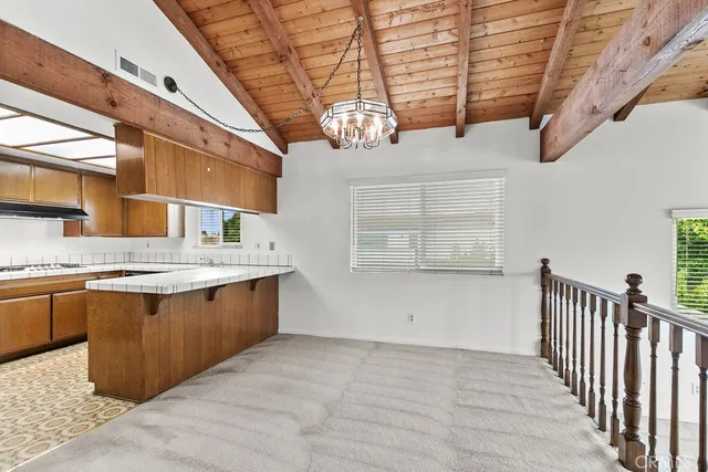 a view of a kitchen with a sink and dishwasher