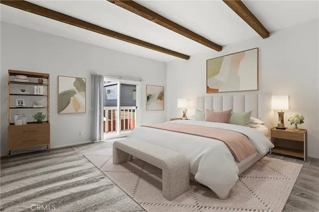 a spacious bedroom with a large bed and a window