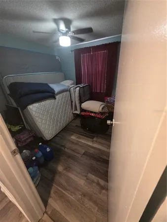 a living room with furniture and a lamp