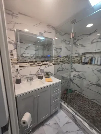 a bathroom with a sink and mirror