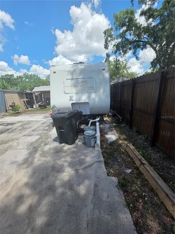 a view of a backyard with pathway