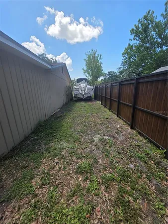 a view of backyard with green space
