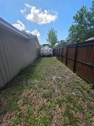 a view of backyard with green space