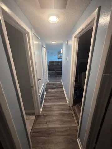 a view of staircase with wooden floor