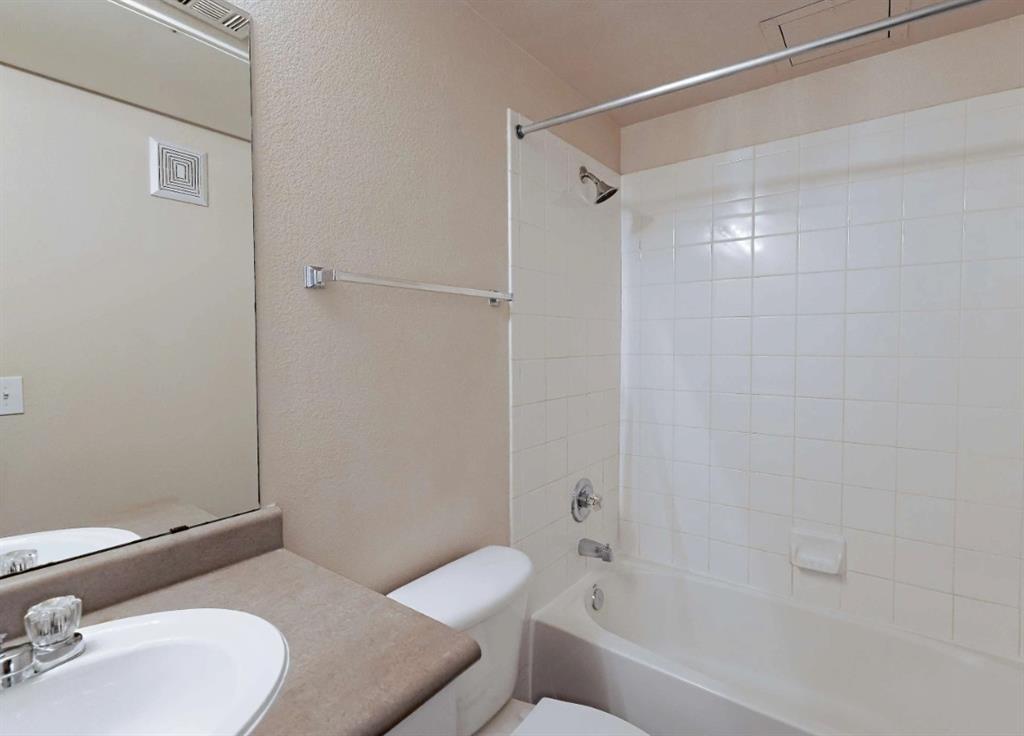 10505 I-35 Frontage Road South, Unit 1718 Austin, TX 78747 - Photo 16 of 21 a bathroom with a sink toilet and shower