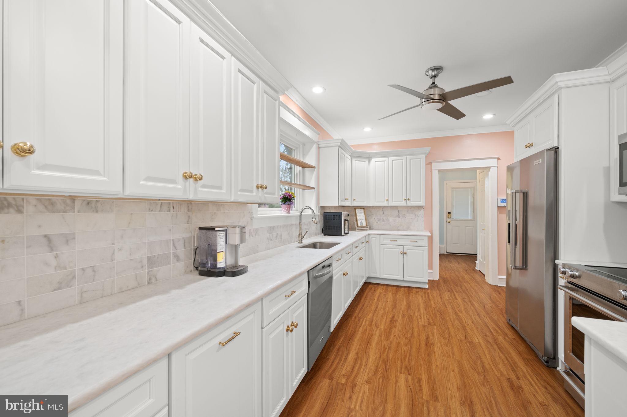 332 South Providence Road Wallingford, PA 19086 - Photo 16 of 69 a kitchen with cabinets a sink and appliances